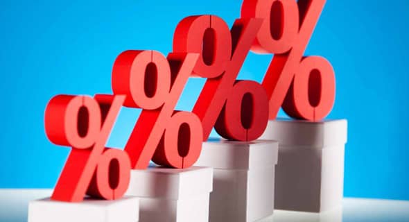 But Don't Forget About Interest Image of percentage signs increasing to depict interest on a credit card.